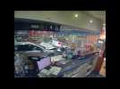 CCTV footage shows car ramming into Sydney gas station