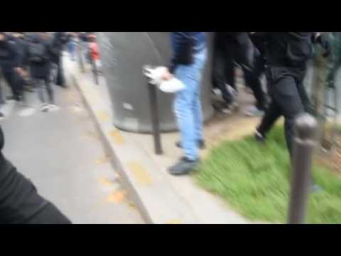 Amateur video shows police car attacked by protesters in Paris