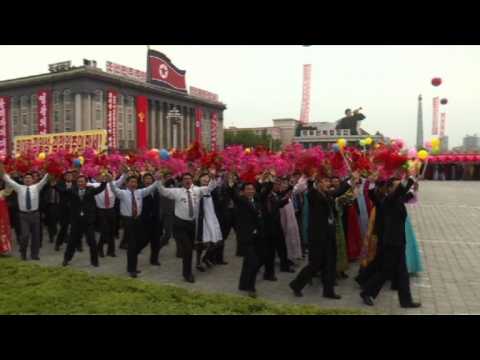 'Chairman Kim' presides over mass parade