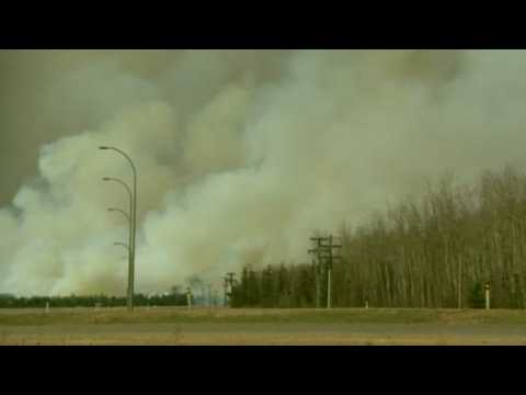 Canada fire rages for seventh day, evacuees set for long wait
