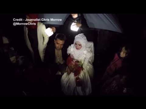 Syrian couple marries in makeshift camp on Greece's closed border with Macedonia