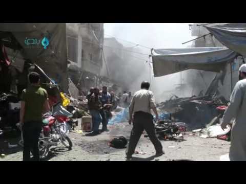 Amateur video shows aftermath of air strike on Idlib market