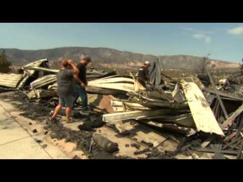 California residents return to wildfire devastation