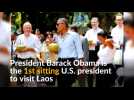 Obama drinks coconut water to cool down in Laos