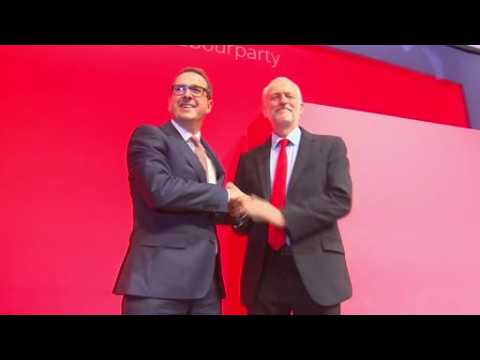Labour's Corbyn pledges party unity after re-election