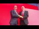 Labour's Corbyn pledges party unity after re-election