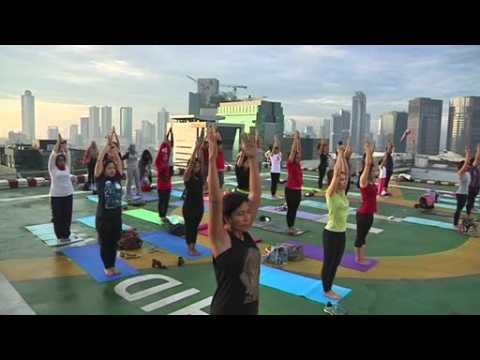 Yoga lovers take to helipad for sky-high sunrise workout in Indonesia