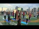 Yoga lovers take to helipad for sky-high sunrise workout in Indonesia