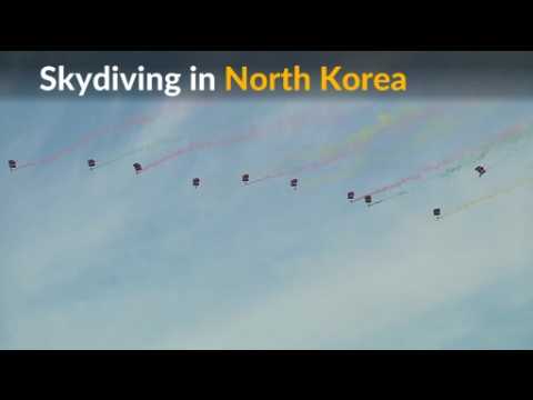 Sky divers drop from the air in North Korea