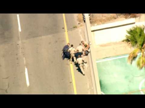 High speed chase drama ends at freeway ledge