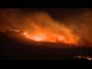 Dozens of wildfires rage across arid West