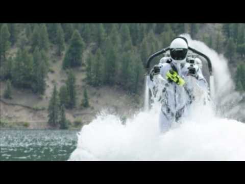 Jet pack pilot performs water stunt