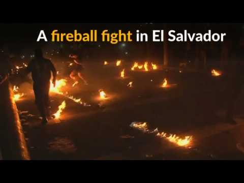 It's a fireball fight! Salvadoran villagers fling burning rags at each other