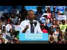 Obama makes solo campaign debut at Clinton rally
