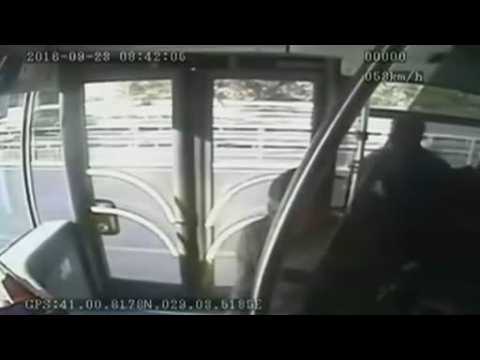 Umbrella-wielding passenger smacks bus driver, causes accident