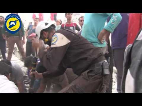 Syria rescuer breaks down as baby pulled from rubble - amateur video