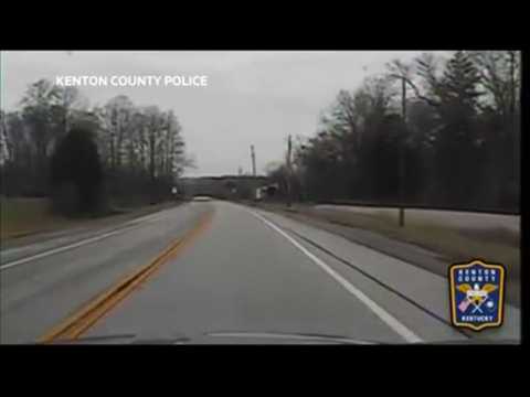 A police dashcam captures the moment whan a car collides with a deer