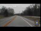 A police dashcam captures the moment whan a car collides with a deer