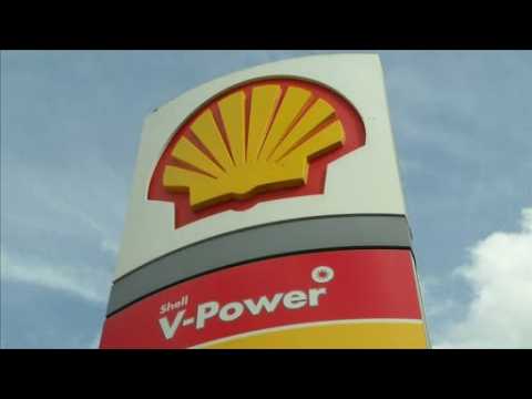 Shell's profits hit by big write-offs