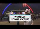 English, French fans pay tribute to victims at Wembley
