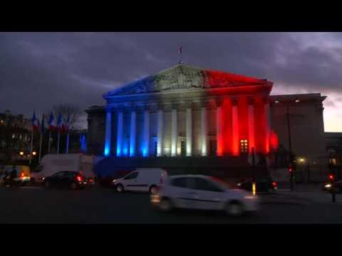 Paris monuments glow red, white and blue in tribute to attack victims