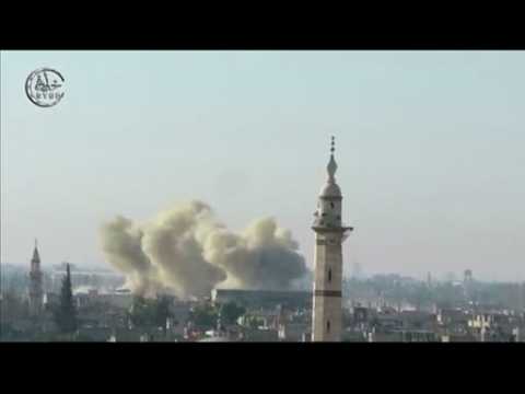 Military air strikes hit Syria, rebels fight back - amateur video