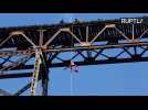 Guatemalan Firefighter Abseils Down Bridge to Give GIfts to Poor Children