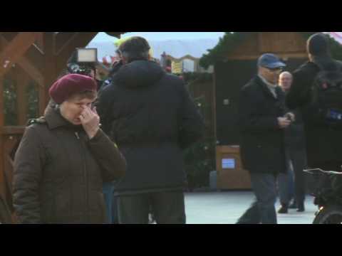 People in Berlin remember victims of market attack