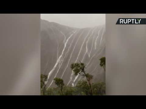 Heavy Rainfall Causes Waterfalls from Ayers Rock
