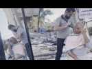 Palestinian barber works amid the rubble of his destroyed shop
