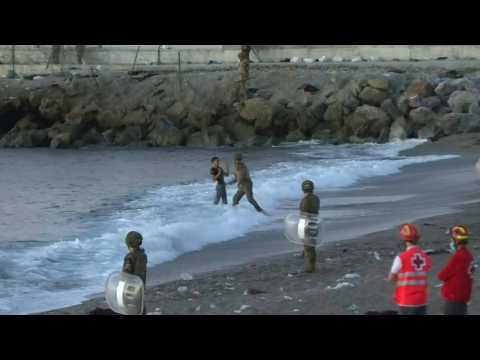 Migrants reaching Ceuta met with force from Spanish police