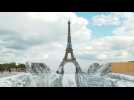 French street artist JR creates Eiffel Tower optical illusion