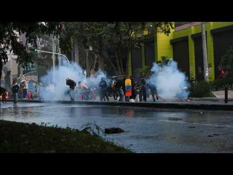 Colombian anti-govt protesters clash with riot police in Medellin