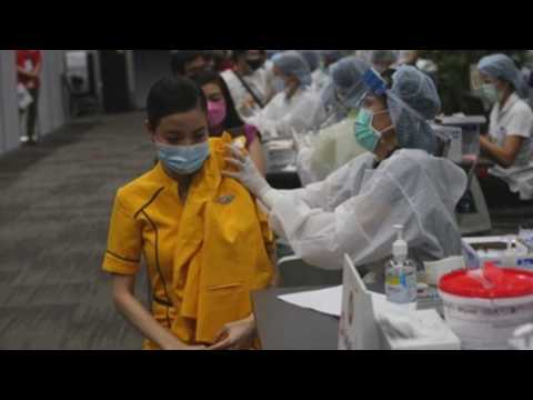 Airlines crew members receive Sinovac COVID-19 vaccine in Thailand