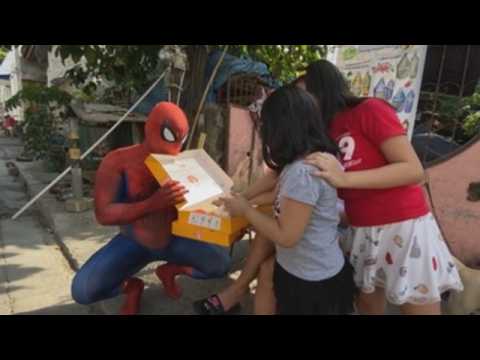 'Spider-Man' surprises Philippines neighborhood with free food