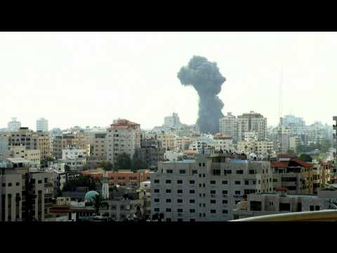 Smoke billows following Israeli strike on Gaza on the first day of Eid