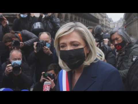 Marine Le Pen places flowers at the Joan of Arc monument in Paris