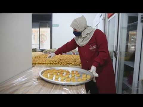 Palestinian women make sweets ahead of the end of Ramadan
