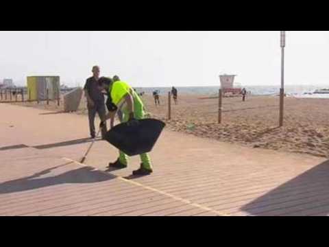Clean up at Barcelona beach after celebrations of end of state of alarm