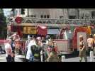 Israeli firefighters at the scene of a rocket explosion in Ramat Gan