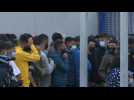 Migrants queue at the border in Ceuta to return to Morocco