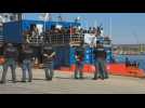 Hundreds of rescued migrants disembark from NGO ship in Sicily