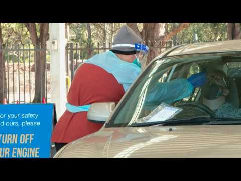 Queues at drive-through Covid testing as Sydney extends lockdown
