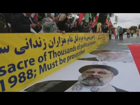 Dozens of people protest in Berlin against the new Iranian president