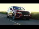 The new Bentley Bentayga Hybrid in Dragon Red Driving Video