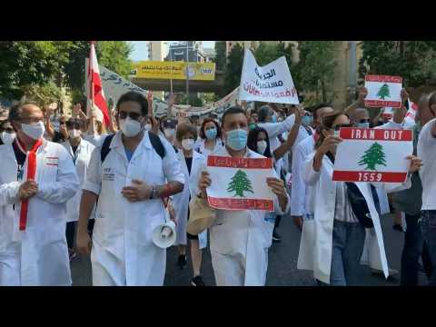 Lebanese march towards Beirut port one year after explosion