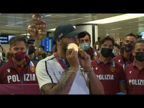 Italy's medal-winning Olympic squad return home