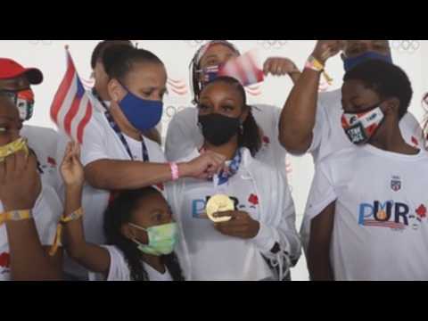 Camacho-Quinn arrives in Puerto Rico, leads caravan wearing Olympic gold