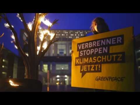 Greenpeace activist protests prior to car summit in Berlin