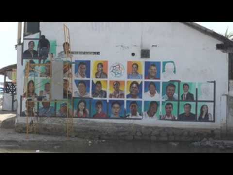 Mexican city of Acapulco paints missing people portraits on mural in hope of finding them